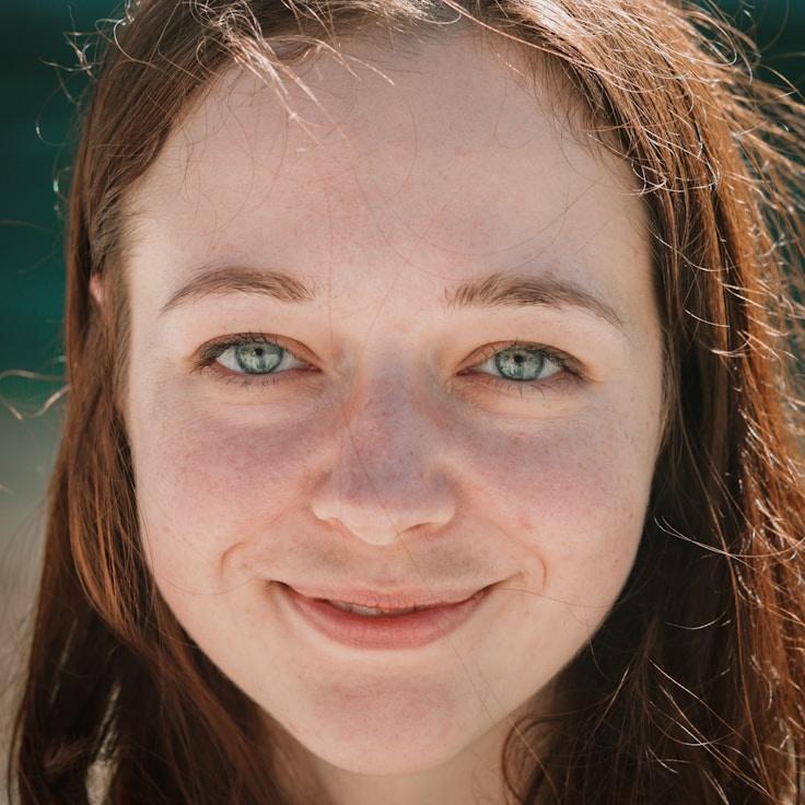 Alex Rivera, Lead Design Curator at Vivid Stream Center, reviewing corporate floral arrangements